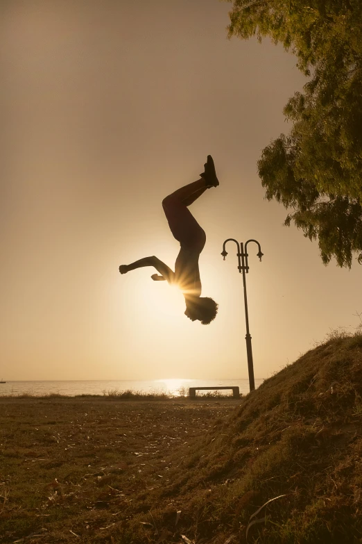 a man is doing tricks while standing on his handstand