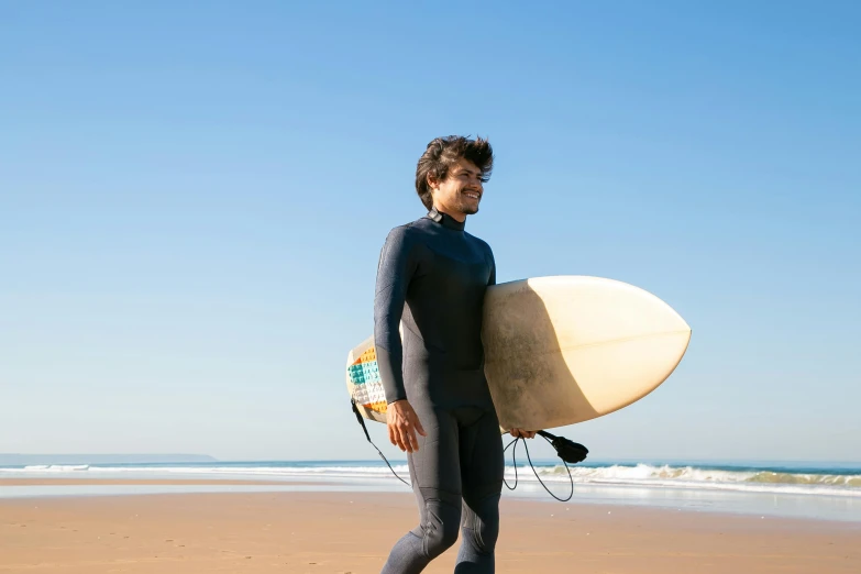 the surfer is heading out to surf