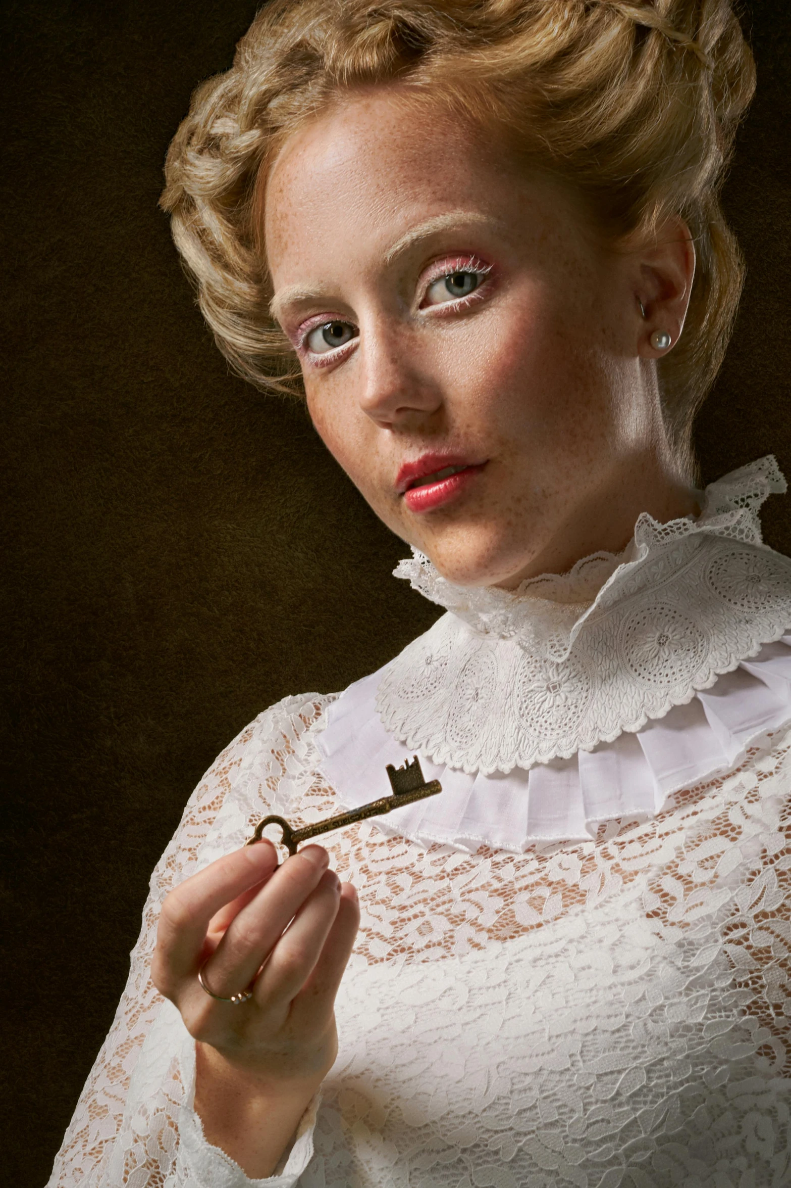 a woman is holding a key to her chest