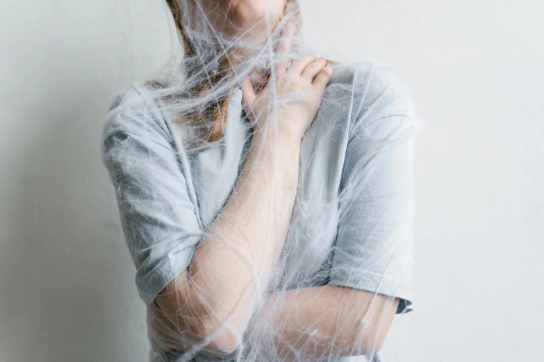 the woman is wearing a veil over her head