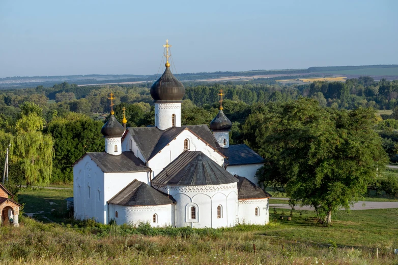 an old white church is shown in this view