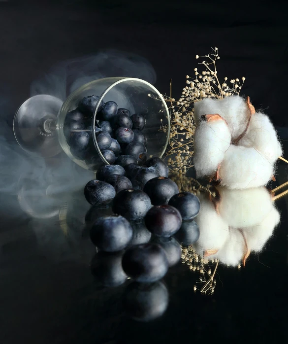 a still life pograph of cotton, gs and cotton swab