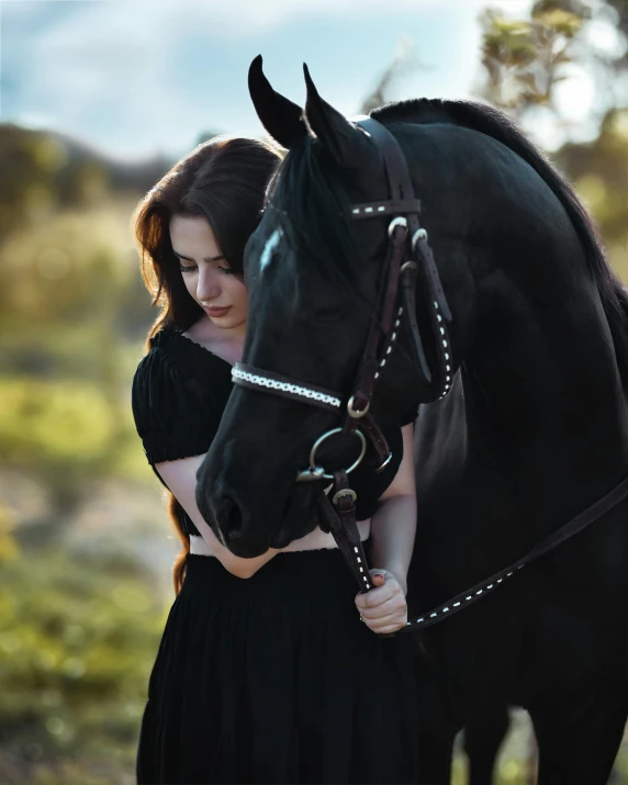 a woman that is petting the side of a horse