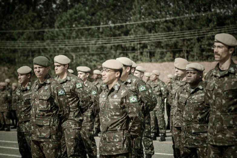 army men in uniform are standing by the street