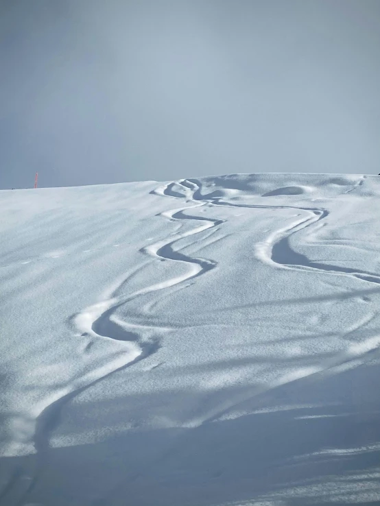 a man on skis going down a slope