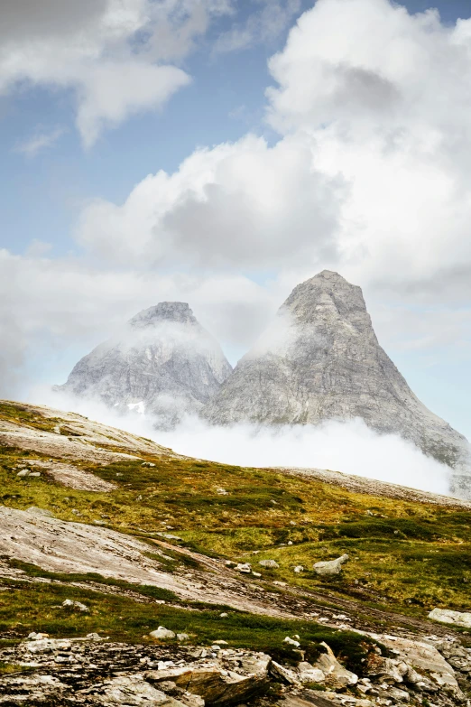 a rocky hillside with a lone person on it