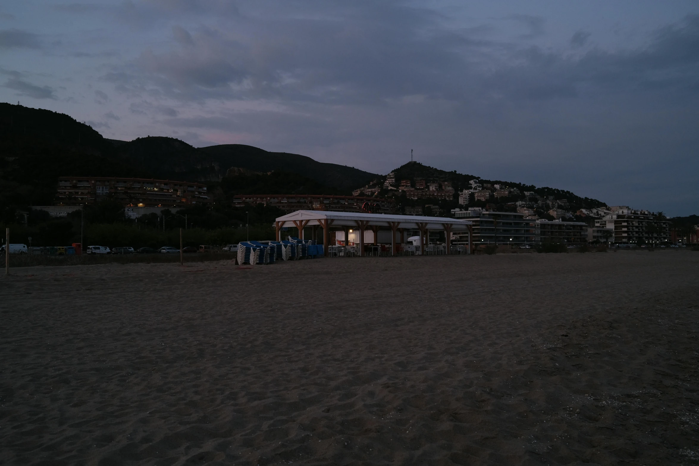 a very small beach area that looks to be at night