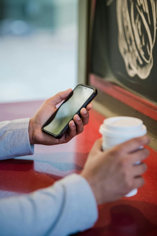 a woman using her cell phone to read information