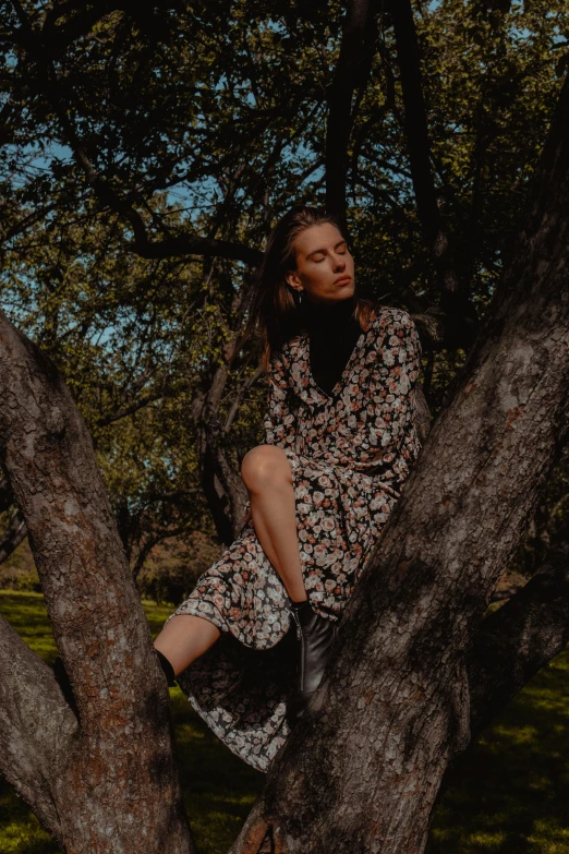 a woman in the middle of a tree