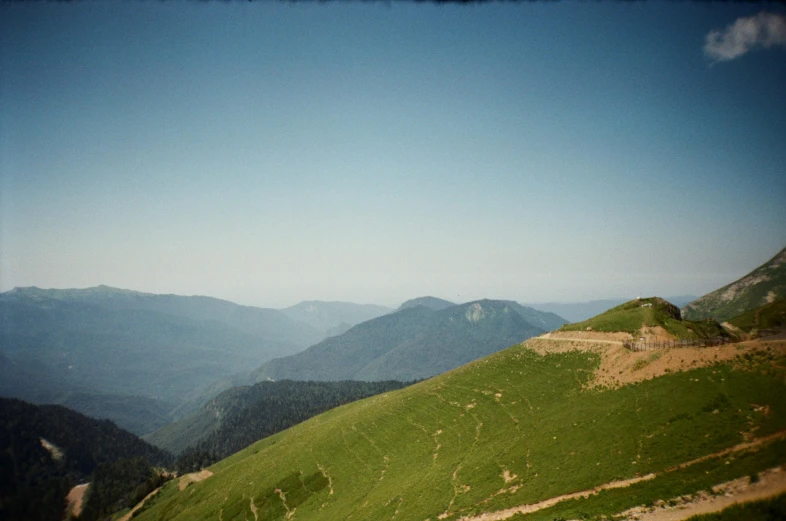 the view from a hill overlooking the green hills