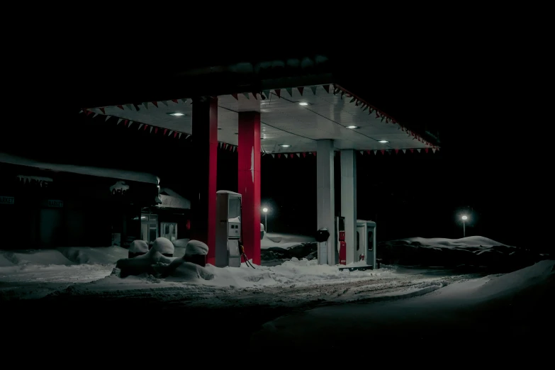 the gas station at night in the snow