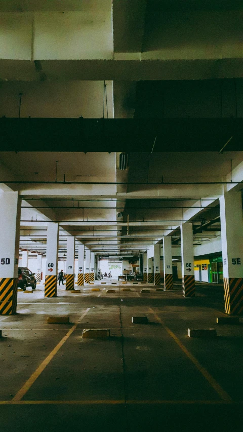 cars parked in a parking garage on the same side of the road