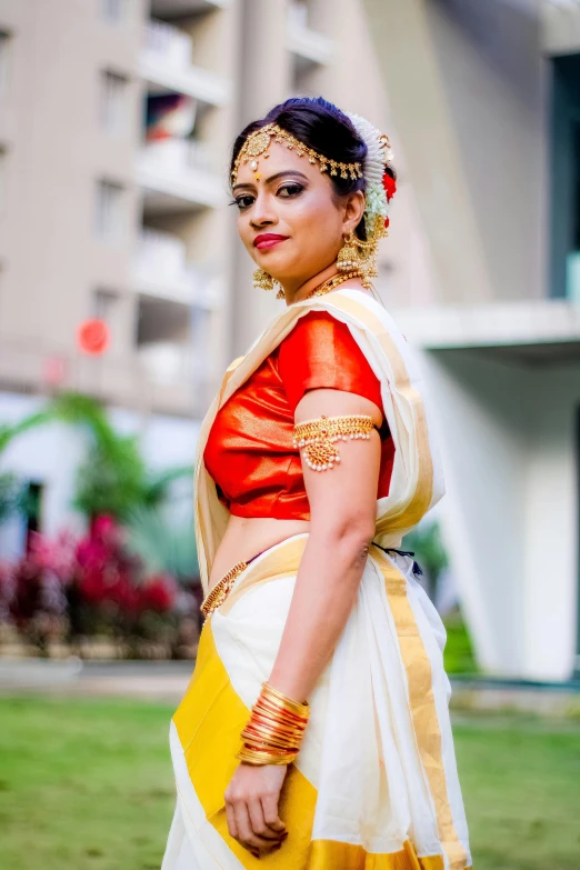 the indian bride is in her traditional wedding dress