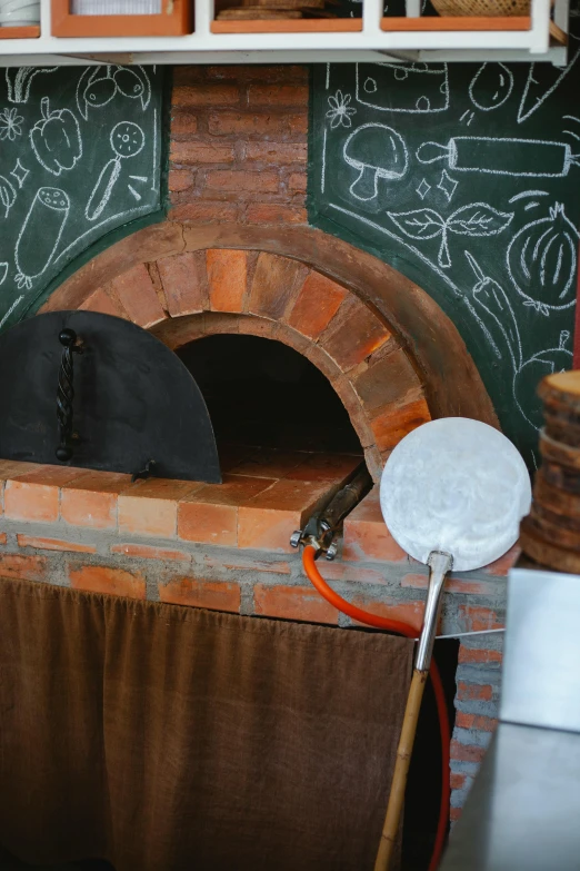 an oven is next to a chalkboard with black and white writing