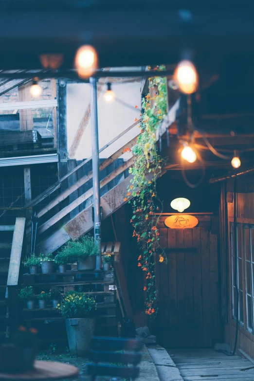 some lights are hanging from the ceiling in front of a building