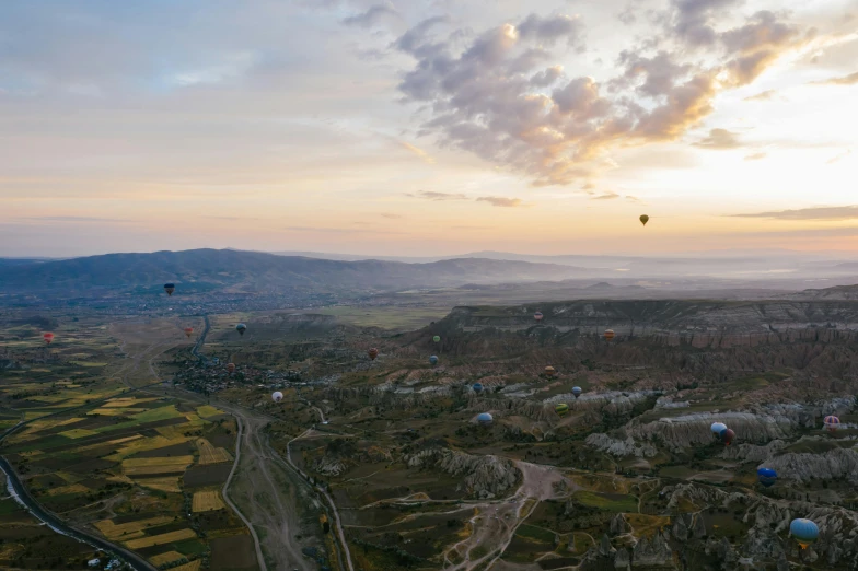 a view from the air over several balloons in the sky