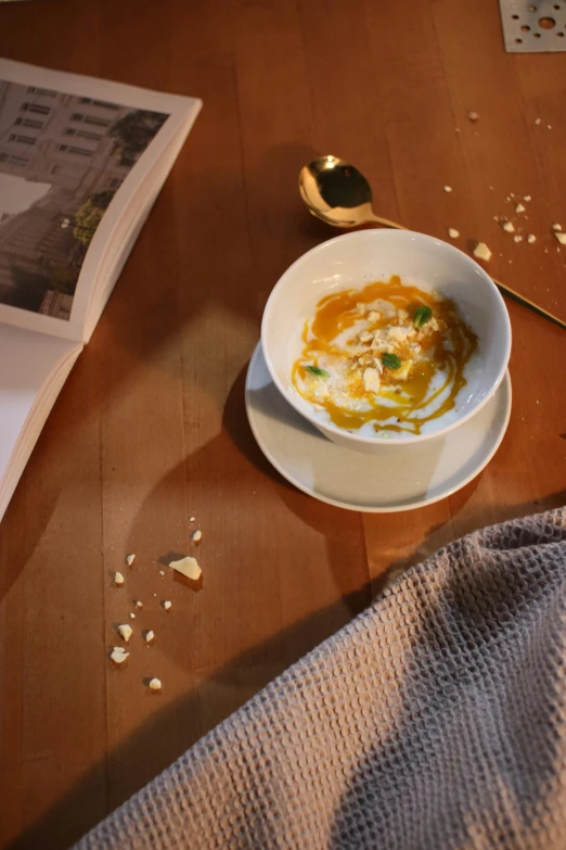 a plate of food is on the table next to a spoon