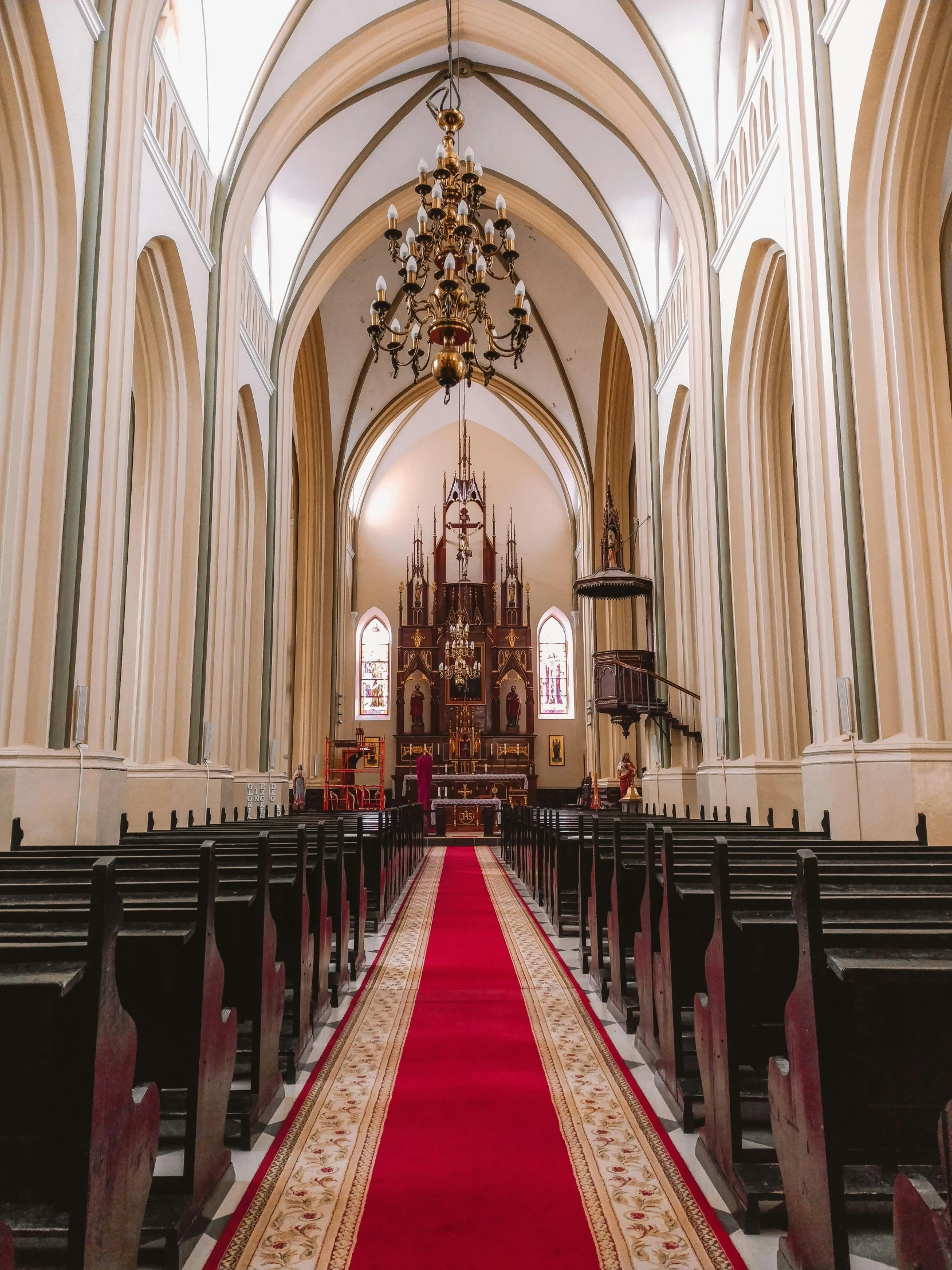 a picture of a cathedral with high ceiling and pews