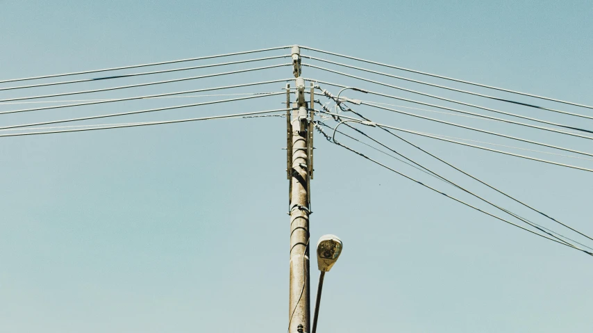 a telephone pole with multiple wires that are connected