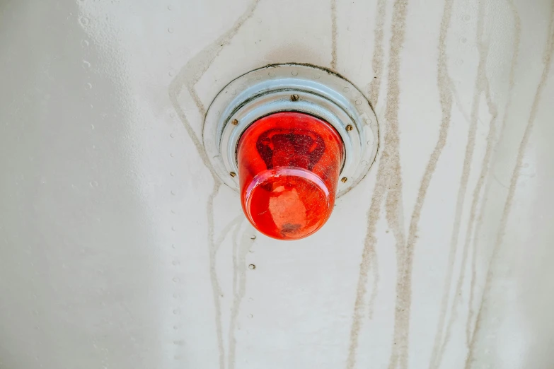 an overhead view of a light with a red light