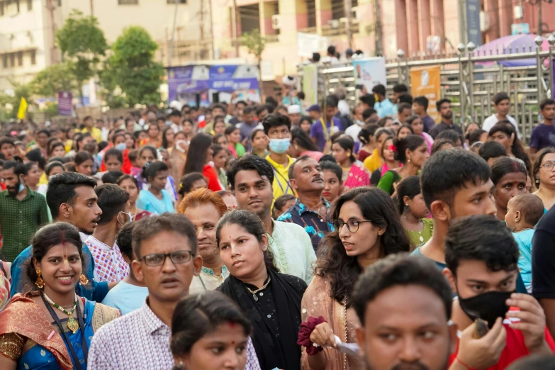 a large crowd of people are all dressed in red and blue