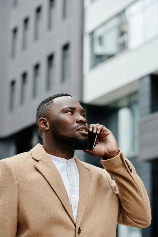 a man with a beard on a cell phone