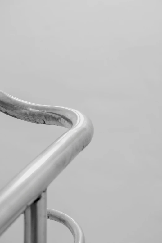 an abstract po of a bent metal railing