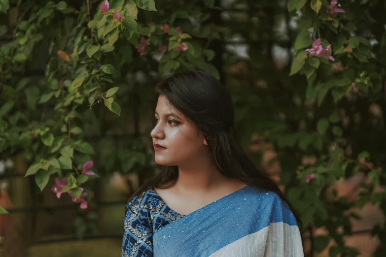 an indian woman is dressed in blue