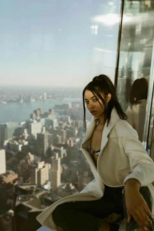 a woman standing on top of a building