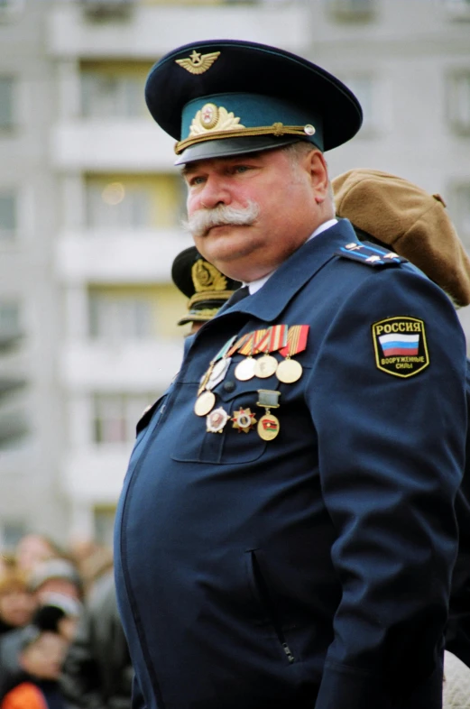a man dressed in uniform and a beard