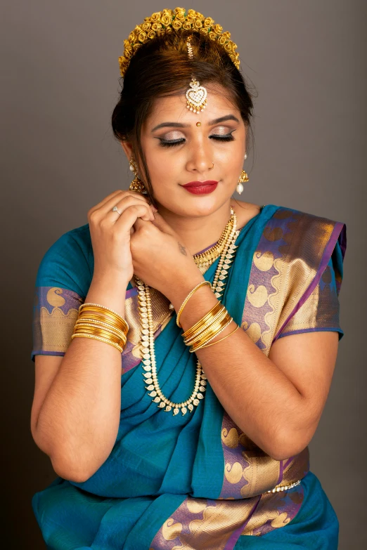 a woman wearing jewelry and a headdress