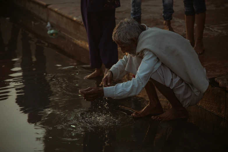 people standing near a wall in water playing