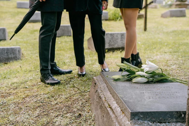 a memorial is in the middle of two women standing behind it