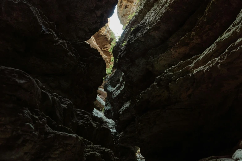 an open canyon with large rock formations and water at its end