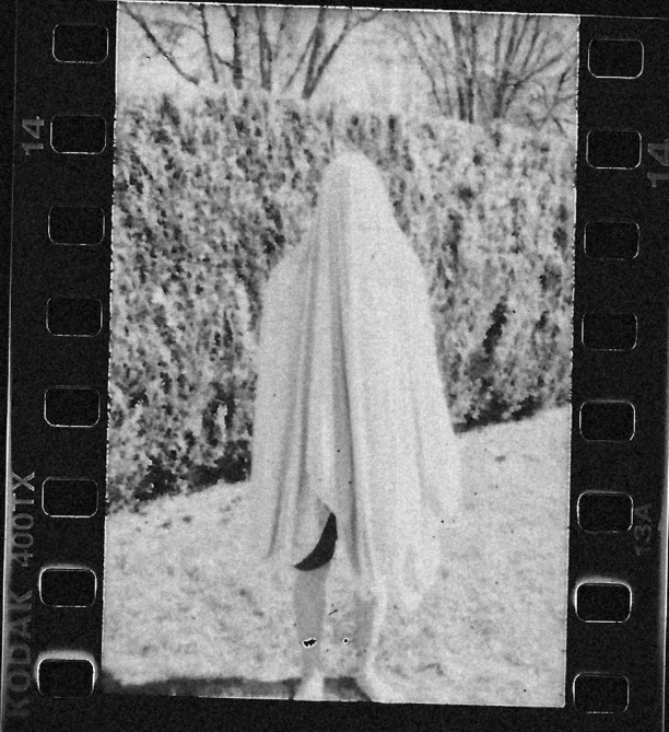 a woman with a large shawl and a black and white pograph