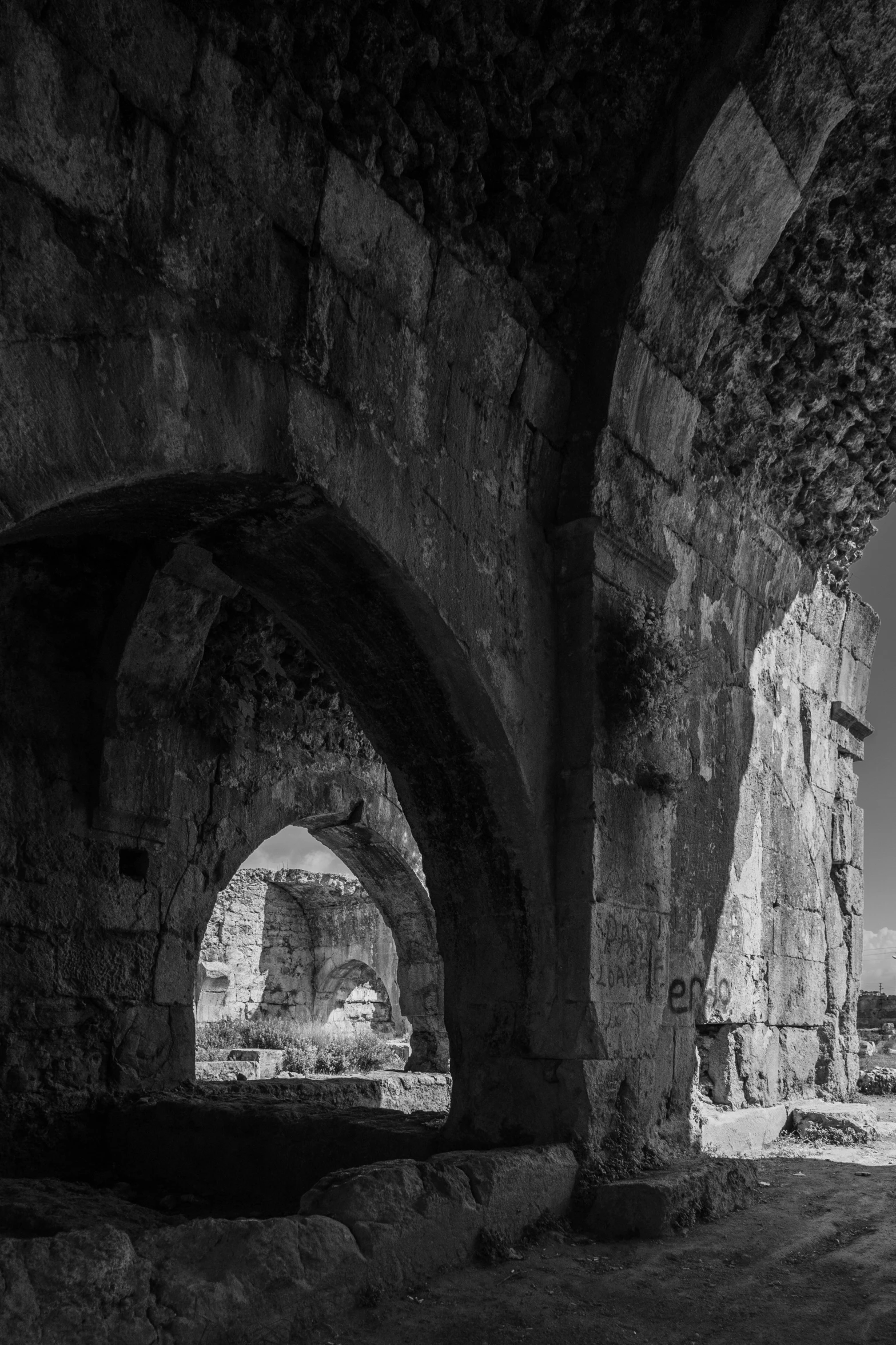 the ancient walls and pillars of a stone building