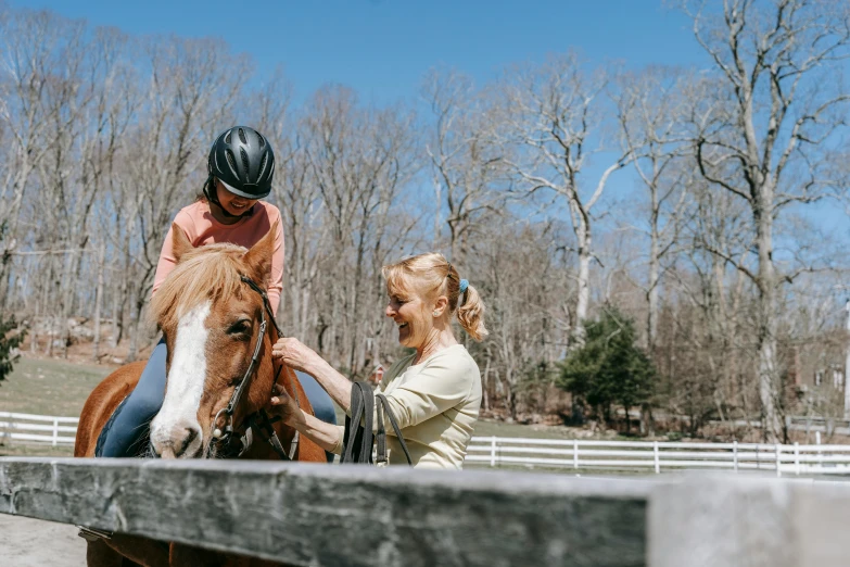 two children giving each other a ride on a horse