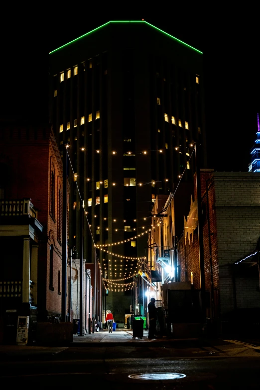 city street at night with buildings and neon lights