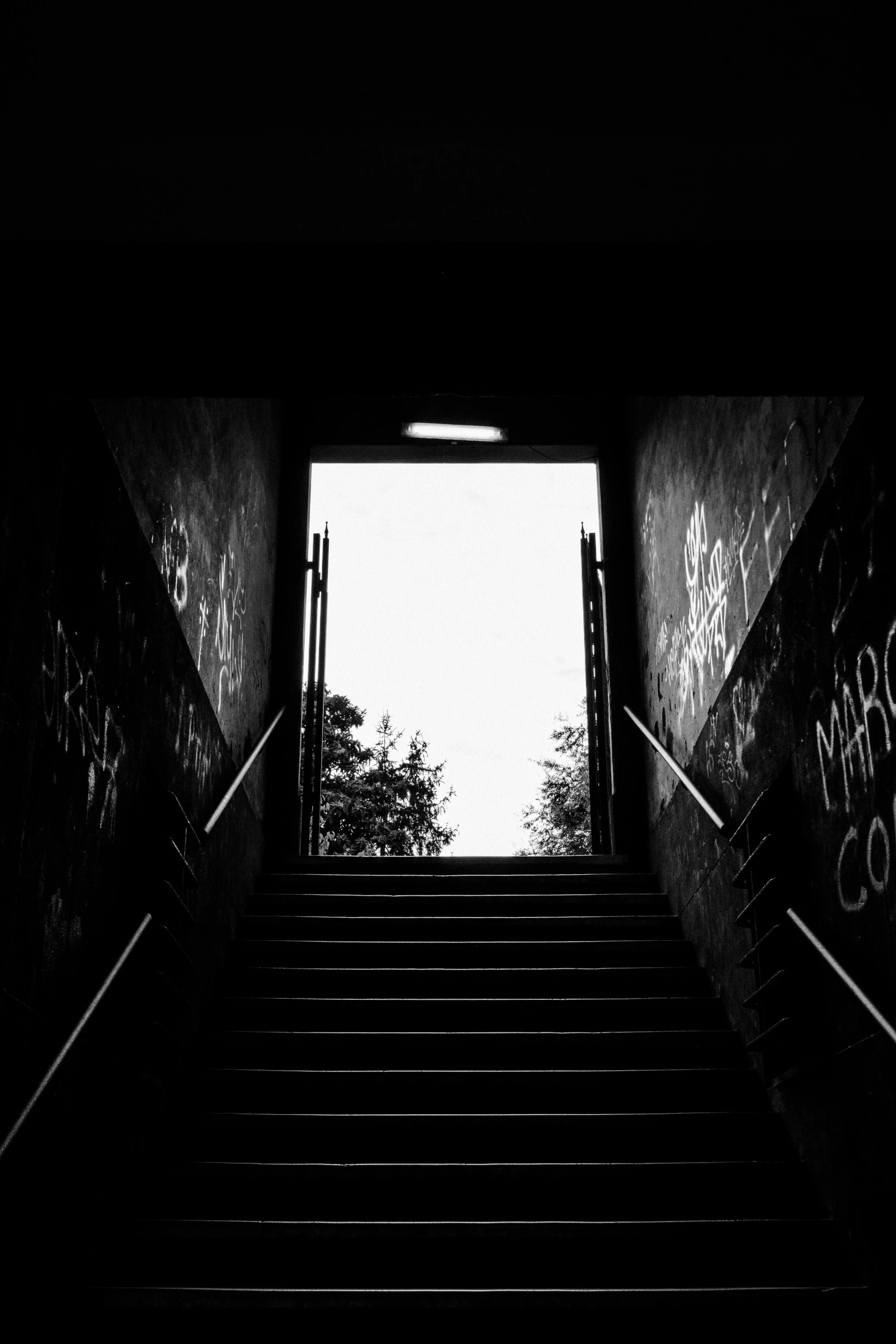 a staircase with lots of graffiti going up and down