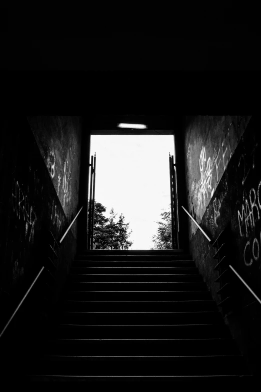 a staircase with lots of graffiti going up and down