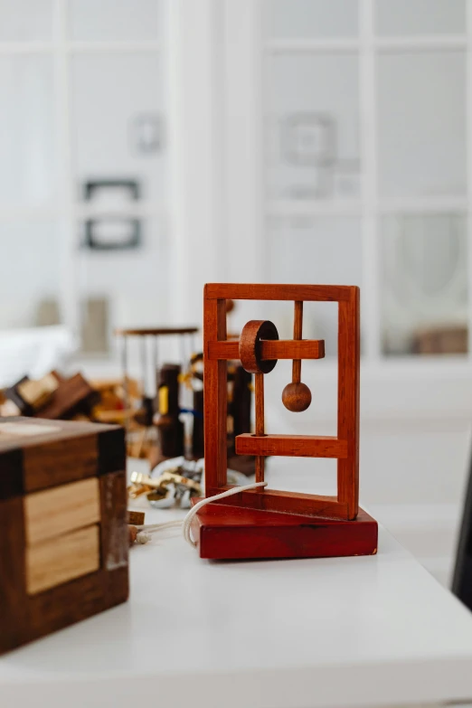 a toy house made out of wooden blocks and bells