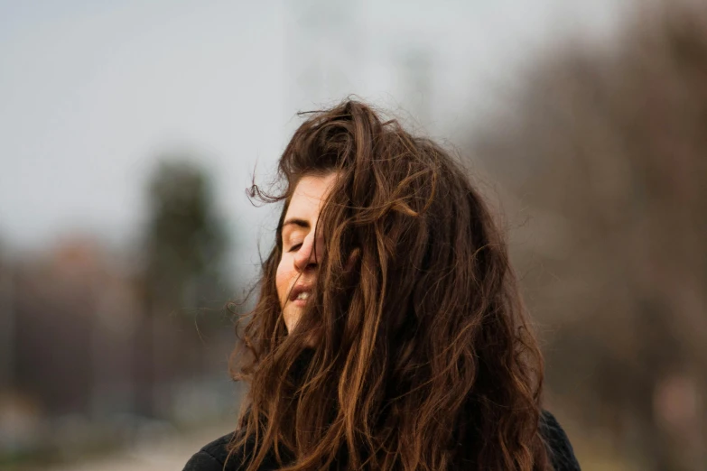 a close up of a person with long hair