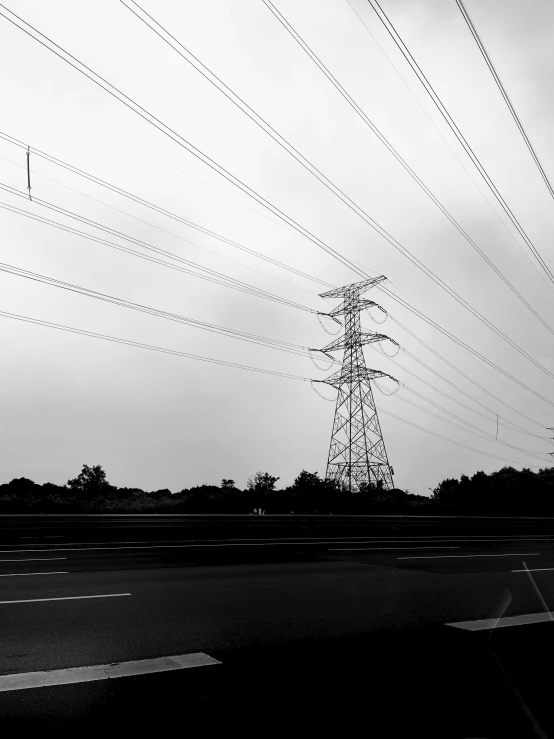 there are many telephone wires above the street