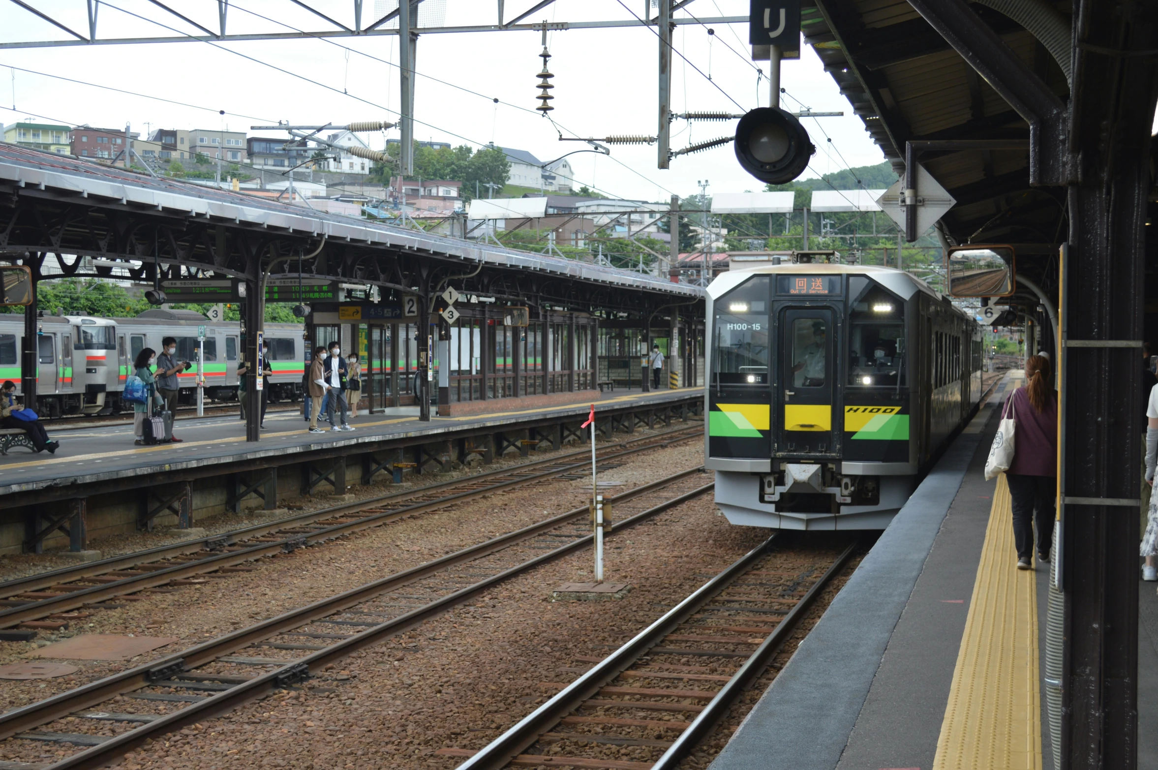 there is a passenger train stopped at the station