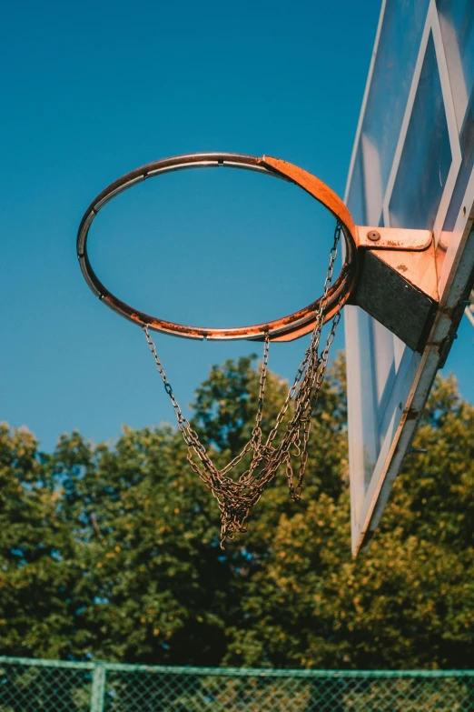 the basketball is being held up outside