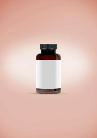 the bottle of medicine is placed on a pink surface