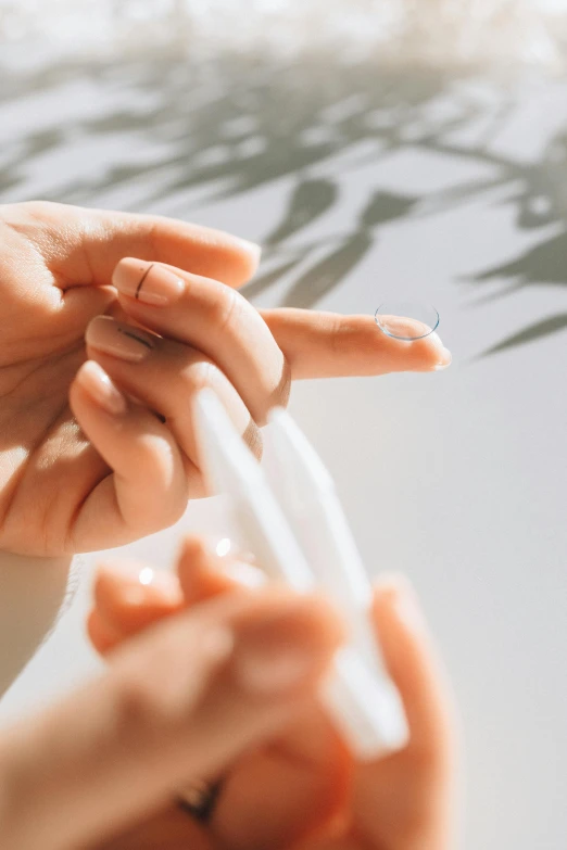 a woman reaching for soing with her hands