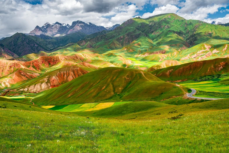 a landscape is pictured with green hills and hills