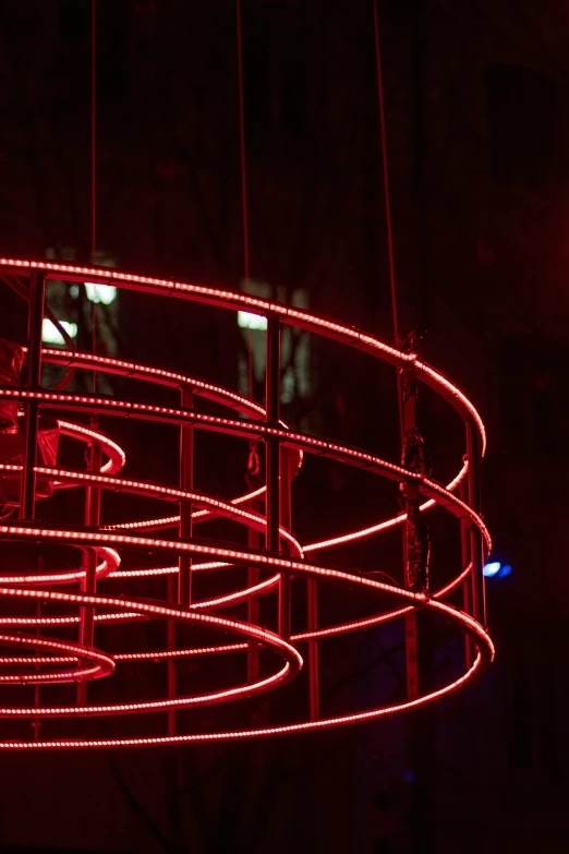 a red circular lit up area in a dark room
