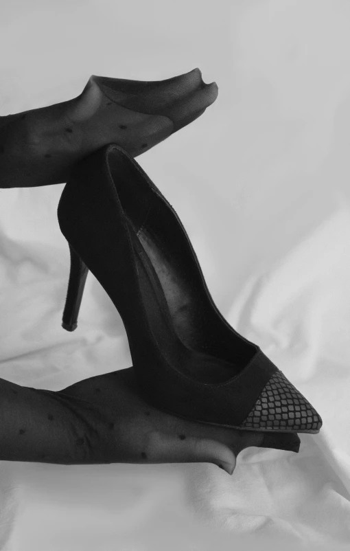 a black and white po of high heeled shoes